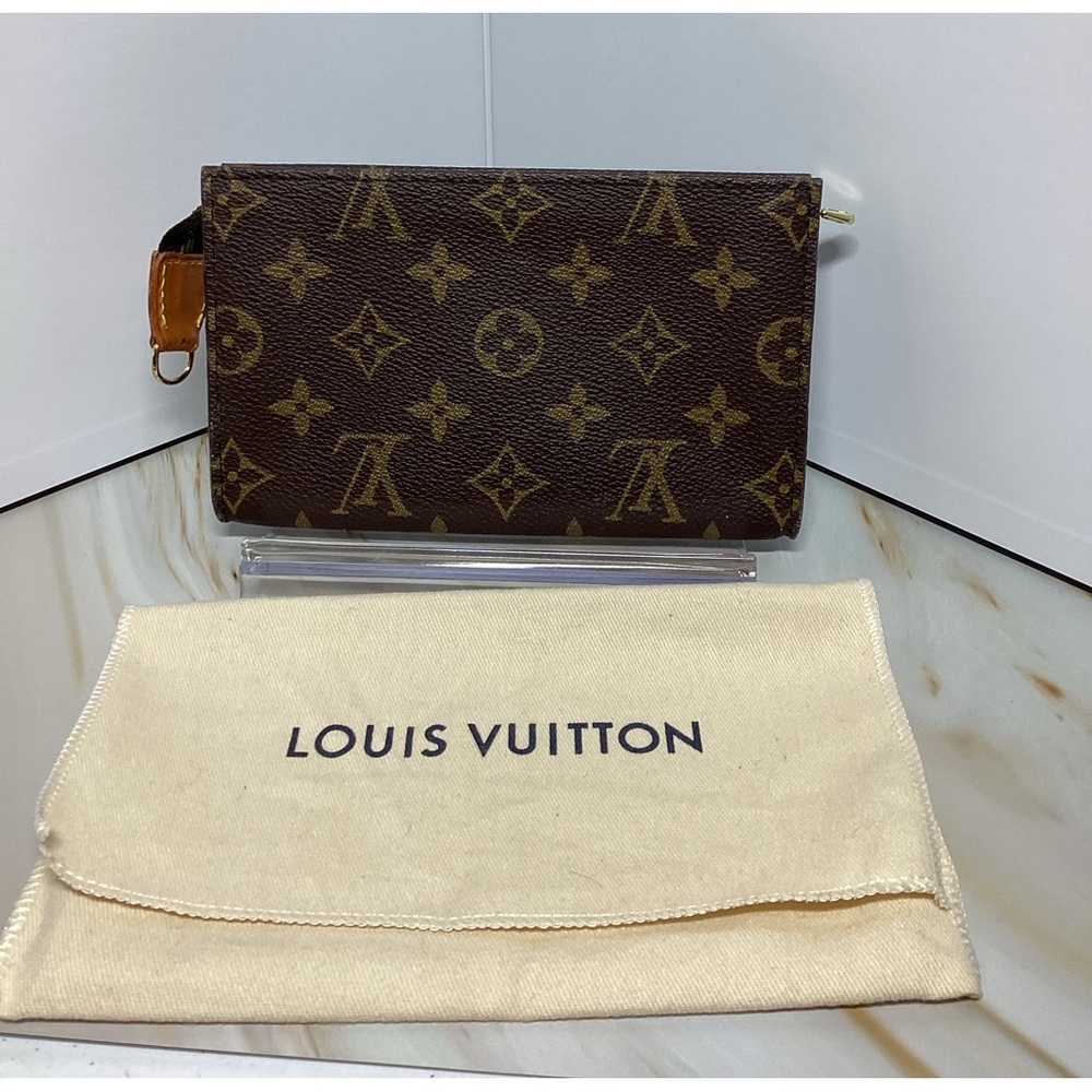 Louis Vuitton cosmetic pouch can be worn crossbody